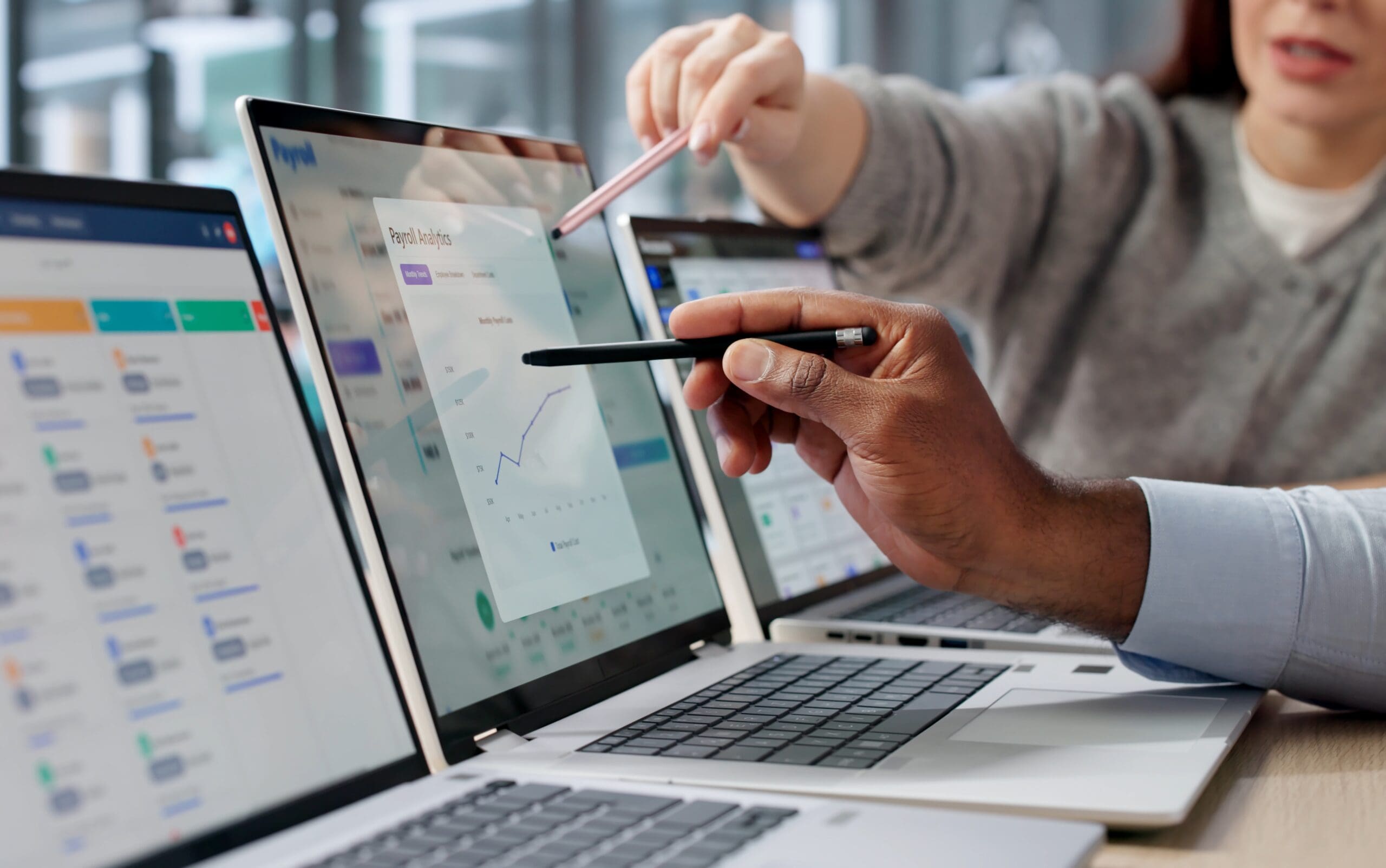 Man-And-Woman-Calculate-Payroll-Review-Invoices
